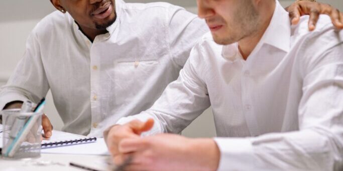 How leaders can support teams through a reorg by protecting trust, reducing ambiguity, and communicating with steadiness.